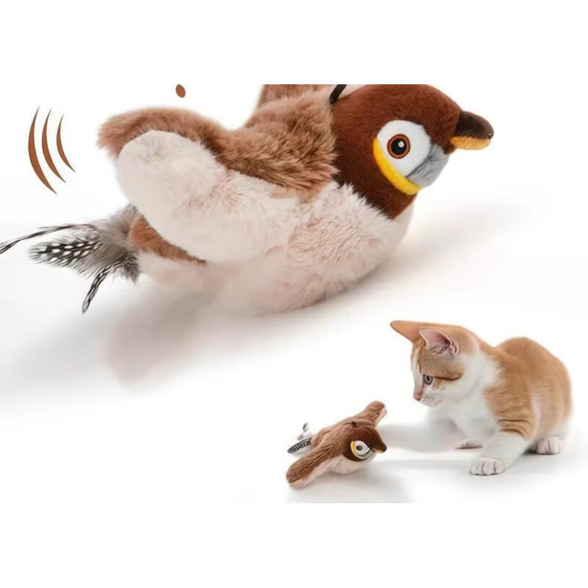Oiseau en peluche qui bat des ailes, à côté d'un chaton